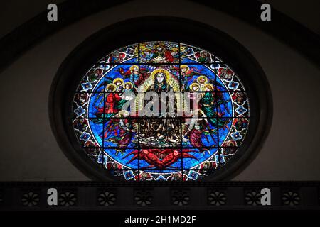 Virgin Mary surrounded by Angels by Lorenzo Ghiberti, 1405, stained glass window in the Cattedrale di Santa Maria del Fiore (Cathedral of Saint Mary o Stock Photo