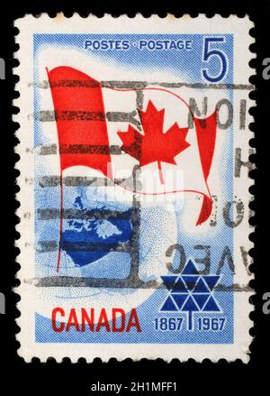 Stamp printed in Canada shows Canada flag, circa 1967 Stock Photo