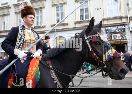 Parade of 70 participants, thirty horses and forty members of a brass band to the main square were announced next, 300th Sinjska alka in Zagreb Stock Photo