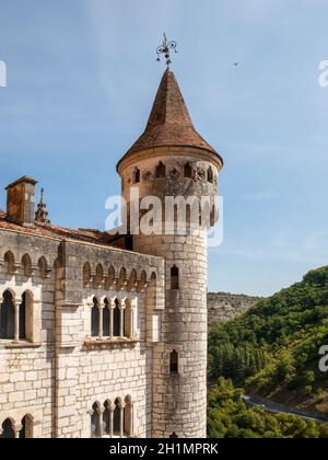 Stone walls of historic Basilica of St-Sauveur blend into the cliff in Rocamadour, France Stock Photo