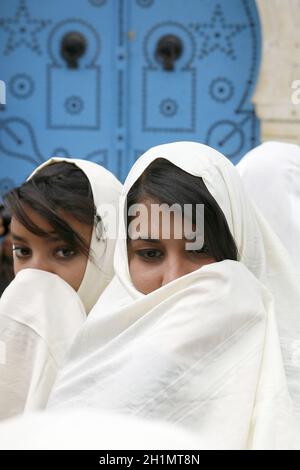 Tunisian Muslim Women in traditional Tunisia clothes in the Old Town of Sidi Bou Said near the City of Tunis in north of Tunisia in North Africa,  Tun Stock Photo