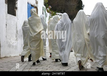 Tunisian Muslim Women in traditional Tunisia clothes in the Old Town of Sidi Bou Said near the City of Tunis in north of Tunisia in North Africa,  Tun Stock Photo