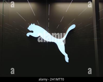 Kiyv, Ukraine - December 5, 2020: Puma logo on a facade of store. Puma is a major german multinational company that produces athletic, casual footwear Stock Photo
