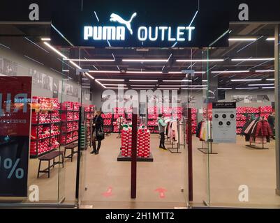Kiyv, Ukraine - December 5, 2020: Puma logo on a facade of store. Puma is a major german multinational company that produces athletic, casual footwear Stock Photo