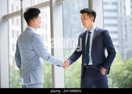 Businessmen shaking hands Stock Photo