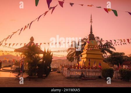 the Wat Chomkao Manilat at the Village of Huay Xai in Lao at the Mekong River from the view in the northwest Lao in Lao.   Lao, Huay Xay, November, 20 Stock Photo