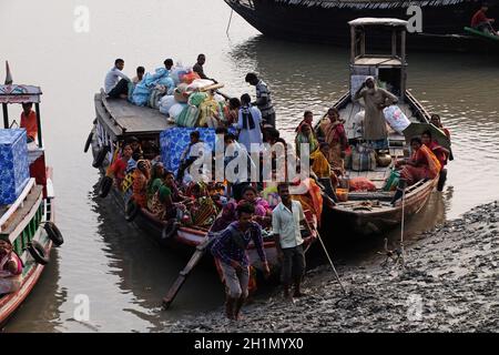 Wooden boat crosses the Ganges River in Sundarbans, West Bengal, India ...
