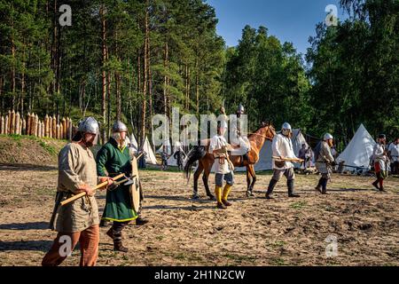 Cedynia, Poland, June 2019 Historical reenactment of Battle of Cedynia, commander on a horse forming a defence line with his soldiers to protect camp Stock Photo