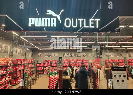 Kiyv, Ukraine - December 5, 2020: Puma logo on a facade of store. Puma is a major german multinational company that produces athletic, casual footwear Stock Photo