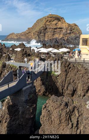 Porto Moniz, Madeira, Portugal - April 18, 2018: Natural rock pool of Porto Moniz on Madeira Island. Portugal.  It is a public bath with water from th Stock Photo