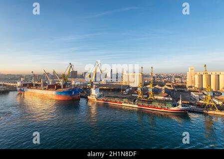 Casablanca, Morocco - December 8, 2016: Discovery Bay Bulk Carrier and Medemborg General Cargo vessel early in the morning at dawn in the seaport of C Stock Photo