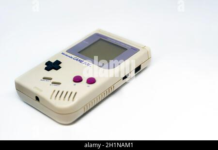 Rome, Italy, December 23, 2020: The Gameboy portable video game console from Nintendo isolated on a white background. Vintage video game console from Stock Photo