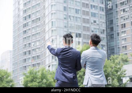 Businessmen looking into the distance Stock Photo