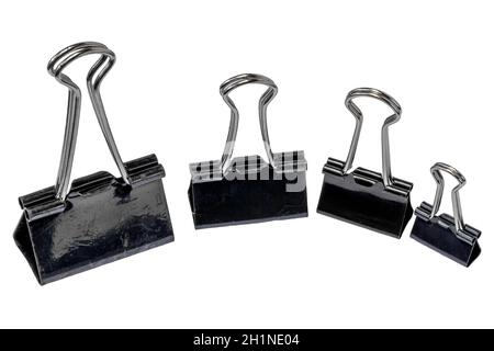 Four black metal paper clips, isolated with a white background, for office, work, school and business concepts Stock Photo