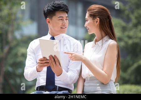 Confident businessmen using a tablet computer Stock Photo