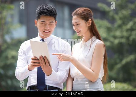 Confident businessmen using a tablet computer Stock Photo