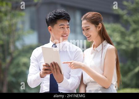 Confident businessmen using a tablet computer Stock Photo