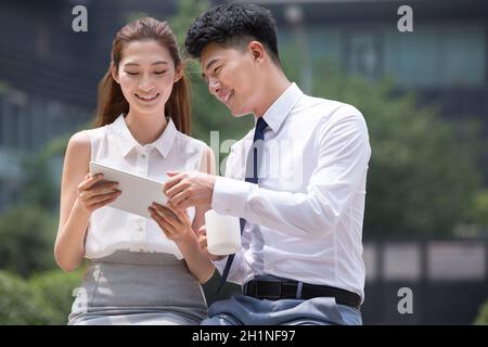 Confident businessmen using a tablet computer Stock Photo
