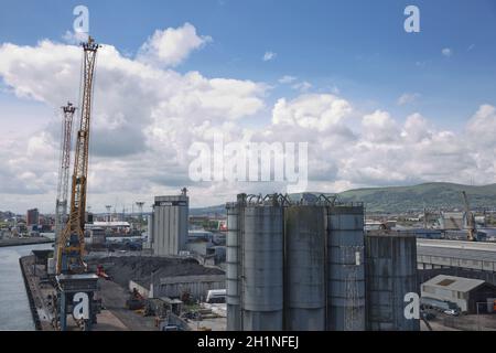 Belfast, Northern Ireland - June 9, 2017:  A view across Belfasts dockland from HMS Caroline in the Titanic Quarter with Carrs glen and Napoleon's Nos Stock Photo