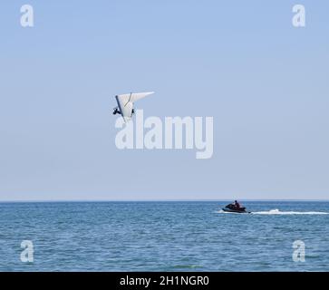 ultralight-trike-flies-in-the-sky-copy-space-paraglide-stock-photo