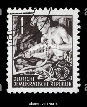 Stamp printed in GDR (German Democratic Republic - East Germany) shows a Hauer without the inscription, from the series Workers For The Five-year Plan Stock Photo