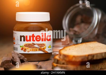 AACHEN, GERMANY - JAN 07, 2021: Pot of Nutella, the popular brand name of a sweetened hazelnut cocoa spread, introduced to the market in 1964 by Itali Stock Photo