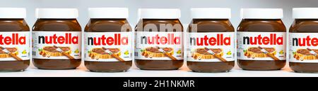 AACHEN, GERMANY - JAN 07, 2021: Pot of Nutella, the popular brand name of a sweetened hazelnut cocoa spread, introduced to the market in 1964 by Itali Stock Photo