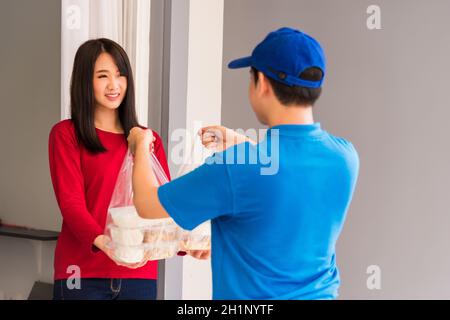 Asian Food Boxes In Plastic Bags Delivered To Customer At Home By