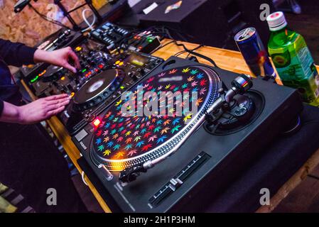 DJ at the remote control. Mixer remote at the concert. Musical equipment. Stock Photo