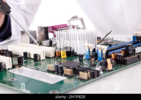 Computer engineer working on an old motherboard Stock Photo