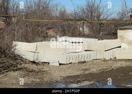 Piled in a heap of concrete blocks. Construction Materials. Stock Photo