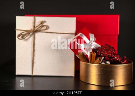 Christmas gift red and white gift box , red apple cinnamon, home fragrance collection in the box with Christmas gift, red and white gift box. Stock Photo