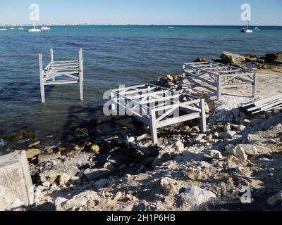 Iron structures on the shore of the Caspian Sea. Construction of the pier. Kazakhstan. Aktau city. 01 October 2019 year. Stock Photo