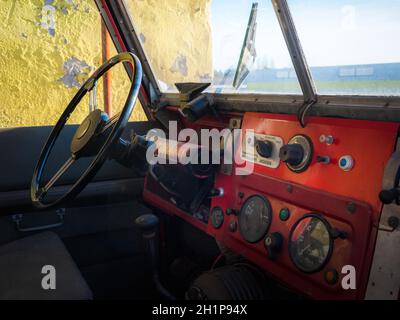 Instrumental panel of an old english off-road car in red Stock Photo