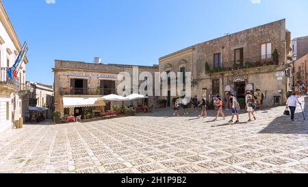 Erice, Sicily, Italy - August 25, 2017: Tourists visit Piazza della Loggia in the ancient town of Erice Stock Photo