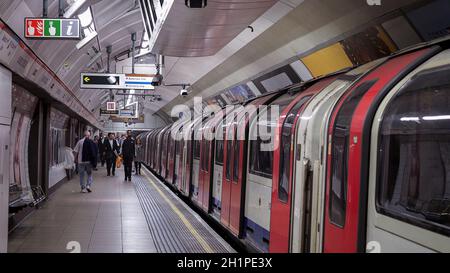 LONDON, UK - CIRCA SEPTEMBER 2019: passengers boarding and alighting London Underground (aka Tube) subway train Stock Photo