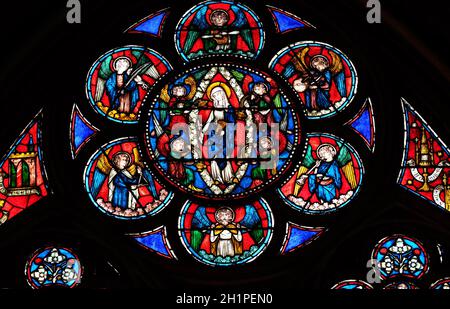 Virgin Mary surrounded by angels, stained glass window in the Notre Dame Cathedral, UNESCO World Heritage Site in Paris, France Stock Photo