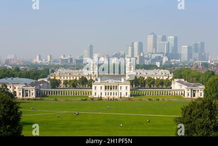 GREENWICH, UK - CIRCA SEPTEMBER 2013: The National Maritime Museum and Canary Wharf in the background, seen from Greenwhich Park. Stock Photo