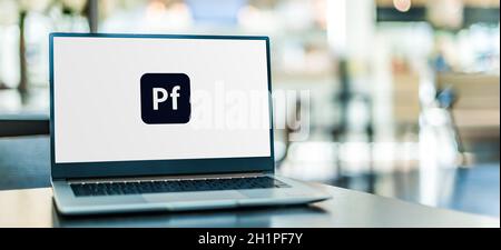 POZNAN, POL - NOV 12, 2020: Laptop computer displaying logo of Adobe Portfolio Stock Photo