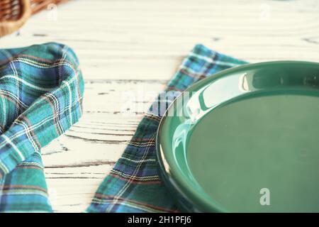 Green plastic kitchenware on a table close up Stock Photo