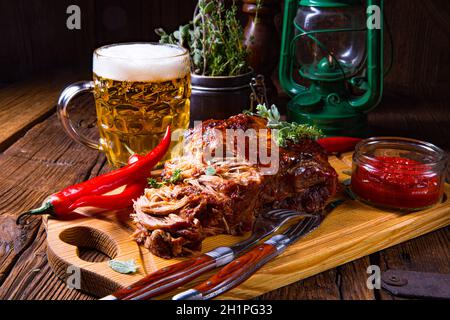 Pulled pork out of the oven with beer sauce Stock Photo
