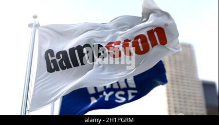 New York, USA, January 28, 2021: Flags of Gamestop and the NYSE waving in the wind. On January 28, 2021, GameStop's short squeeze raised the share pri Stock Photo