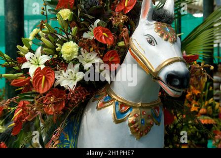 Close-up of plaster image of white horse laden with flowers at Republic Day Flower Show at Lalbagh in Bengaluru, India, Asia Stock Photo