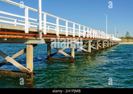 The heritage listed 1.8 kilometres long Busselton Jetty over the waters of Geographe Bay is the longest timber-piled jetty in the Southern Hemisphere Stock Photo