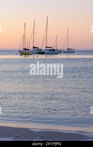 Yachts anchored in the bay at twilight - Dunsborough, WA, Australia Stock Photo