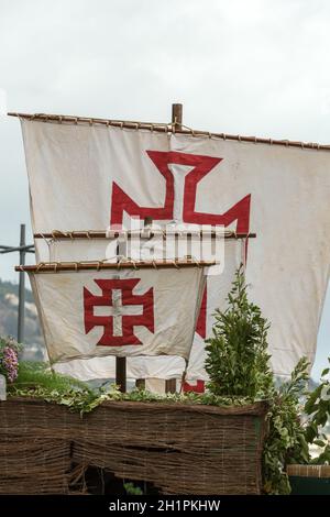 Cross of the Order of Christ on the sails of ships during the Madeira Wine Festival in Funchal. Portugal Stock Photo