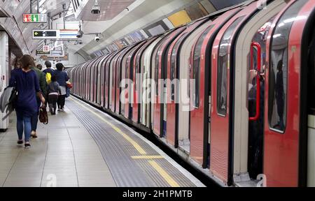 LONDON, UK - CIRCA SEPTEMBER 2019: passengers boarding and alighting London Underground (aka Tube) subway train Stock Photo