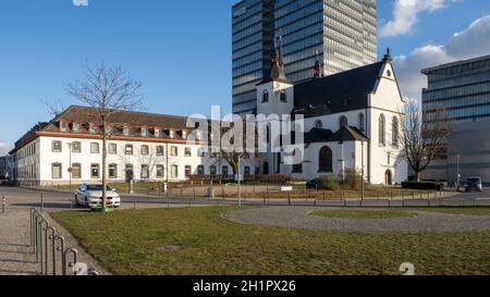 Church Alt St. Heribert and Catitas Olt People's Home with LANXESS Headquarters in the Background - Cologne Stock Photo