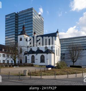 Kirche Alt St. Heribert with LANXESS Headquarter in the Background - Köln Stock Photo