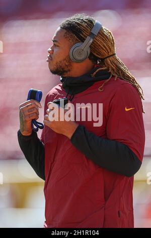 Sunday, October 17, 2021; Landover, MD, USA;  Washington Football Team defensive end Chase Young (99) listens to music at pregame warmups prior to an Stock Photo